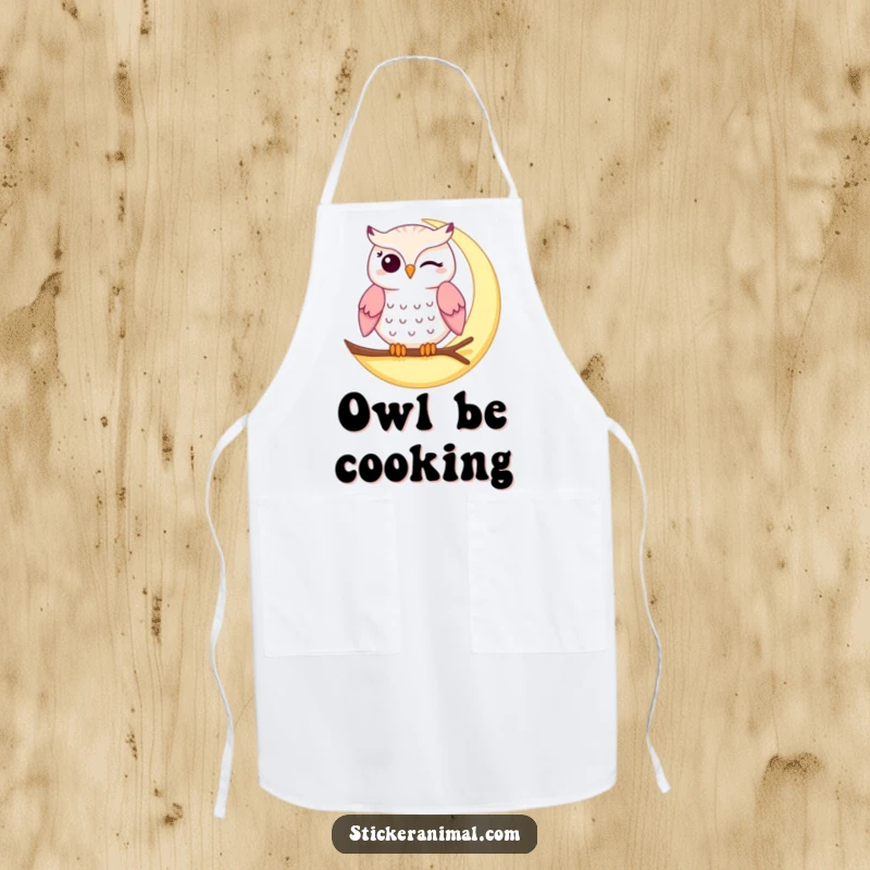 Funny winking owl apron showing a mischievous owl winking on a crescent moon, designed for kitchen fun and protection.
