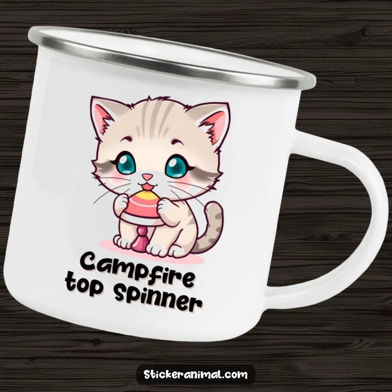 Funny camping mug featuring a playful kitten balancing a spinning top on its nose, perfect for outdoor enjoyment and feline admiration.